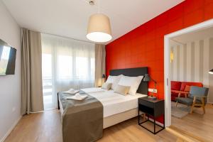 Postel nebo postele na pokoji v ubytování Hotel Forrás Zalakaros