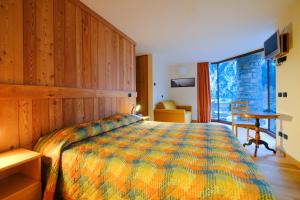 Postelja oz. postelje v sobi nastanitve Hotel Aigle