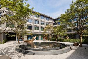 a statue of a dog in front of a building at THE HOTEL HIGASHIYAMA KYOTO TOKYU, A Pan Pacific Hotel in Kyoto
