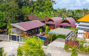 an overhead view of a house with colorful roofs at Gama’s Villa in Tabanan