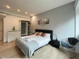 A bed or beds in a room at Stay U-nique Apartments Sants