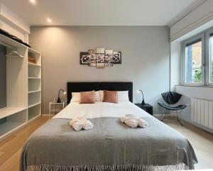 A bed or beds in a room at Stay U-nique Apartments Sants