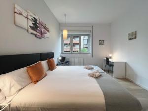 A bed or beds in a room at Stay U-nique Apartments Sants