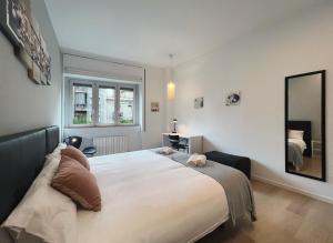 A bed or beds in a room at Stay U-nique Apartments Sants