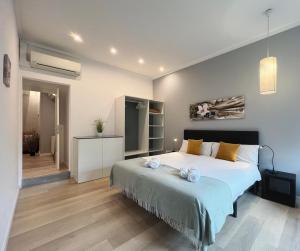 A bed or beds in a room at Stay U-nique Apartments Sants