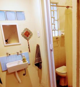 a bathroom with a sink and a toilet at Casa Mágica SP - Próximo CEIC Itaú e SP Expo in Sao Paulo +37 photos
