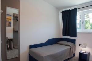 A bed or beds in a room at Lough appartamento