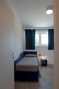 A bed or beds in a room at Lough appartamento