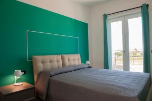 A bed or beds in a room at Lough appartamento