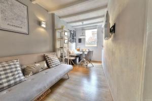 a living room with a couch and a table at Santo Spirito Romantic by Mmega in Florence