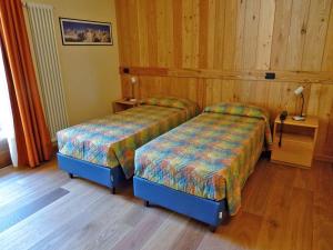 Postelja oz. postelje v sobi nastanitve Hotel Aigle