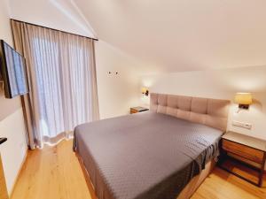 Łóżko lub łóżka w pokoju w obiekcie Mei-Chalet
