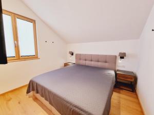 Łóżko lub łóżka w pokoju w obiekcie Mei-Chalet