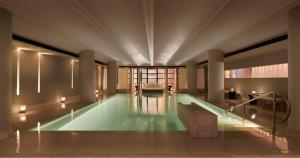 a large swimming pool in a large building at Claridge's in London