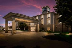 a rendering of a hotel with a parking lot at Best Western Coffeyville Central Business District Inn and Suites in Coffeyville