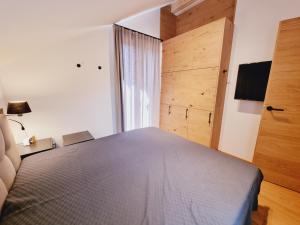 Łóżko lub łóżka w pokoju w obiekcie Mei-Chalet