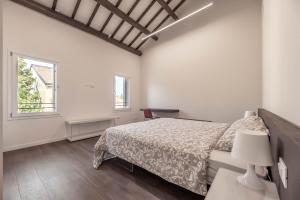 Llit o llits en una habitació de Palazzo '900 Design Flats - L'Orto