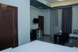 Voodi või voodid majutusasutuse Welcome Inn Hotel toas