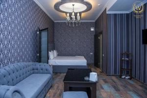 Voodi või voodid majutusasutuse Welcome Inn Hotel toas