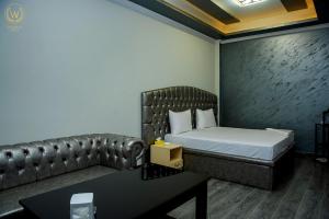 Voodi või voodid majutusasutuse Welcome Inn Hotel toas