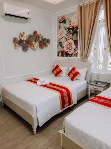 Katil atau katil-katil dalam bilik di Thiên Phú Hotel