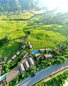 an aerial view of a farm with a road at Eco Palms House - Sapa Retreat in Sa Pa