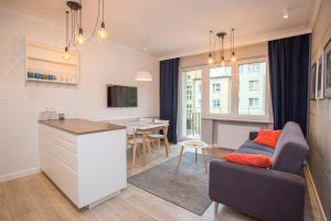 Televízia a/alebo spoločenská miestnosť v ubytovaní Duży apartament w centrum przy rynku