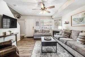 a living room with a couch and a ceiling fan at Bear Lake Blue in Garden City