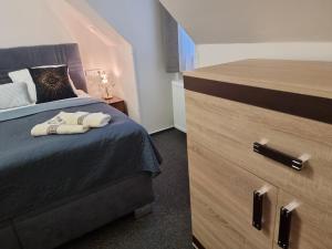 Postel nebo postele na pokoji v ubytování Penzion U Skály