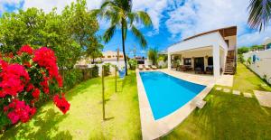 an image of a villa with a swimming pool at VILLA TROPICAL LUX in Pipa
