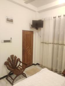Μια τηλεόραση ή/και κέντρο ψυχαγωγίας στο Happy Hours Guest House & Restaurant