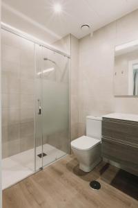 a bathroom with a shower and a toilet and a sink at Apartamentos SubUp in Cabo de Palos