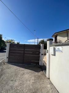 a gate to a driveway in a house at Villa Russo Apartment in Trecastagni