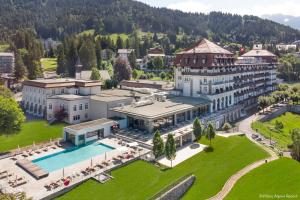 an aerial view of a large building with a pool at Villars Palace in Villars-sur-Ollon