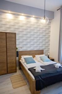 Posteľ alebo postele v izbe v ubytovaní Apartment Cappuccino