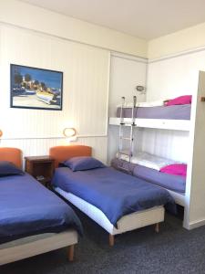a room with two bunk beds in it at AUBERGE RIVA BELLA in Le Touquet-Paris-Plage