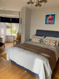 a bedroom with a large bed in a room at The Patch in Hill Head