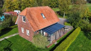 an overhead view of a brick house with an orange roof at Haus Fischkutter in Leezdorf