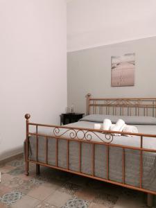a bedroom with a bed in a room at Whiteflower Apartments in Bari