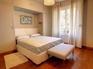 a bedroom with a large bed and a window at 2 bedroom, 2 bathrooms Suquet with sea view 314 in Cannes