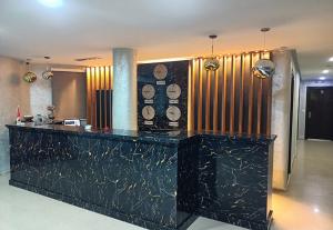 a lobby with a counter in a hotel room at Hotel Diar Meriam in Sousse