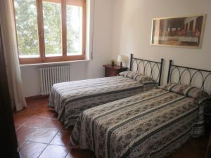 Voodi või voodid majutusasutuse Casa vacanza montecapino toas