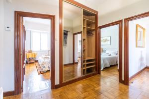 a large mirror in a room with a bedroom at ¡Recién publicado!Amezola - Bilbao in Bilbao
