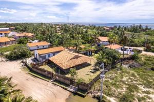 an aerial view of a village with a house at Casa de Maria na Praia de Atins in Atins