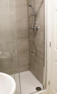 a shower stall with a glass door in a bathroom at Oxford - Private House with Garden & Parking 14 in Yarnton
