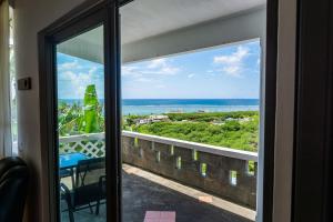 a view of the ocean from a balcony at Eagles Nest Residence in Rodrigues Island