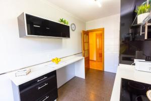 A kitchen or kitchenette at APARTAMENTOS RIAMAR 2