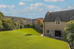 a large lawn in front of a house at Staddlestone Mews in Broadway