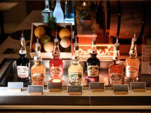 a display of bottles of alcohol on a shelf at Super Hotel Premier Ikebukuro Natural Hot Spring in Tokyo