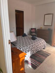 מיטה או מיטות בחדר ב-Casa Helena